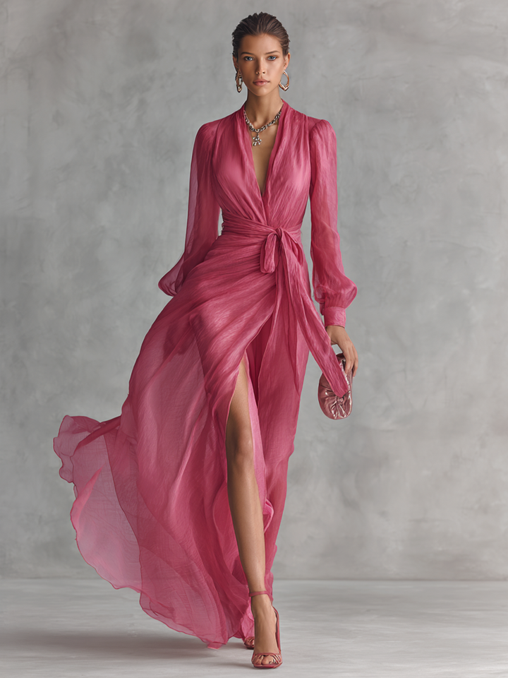 Elegant long women's dress in pearl pink chiffon with V-neck and waist belt