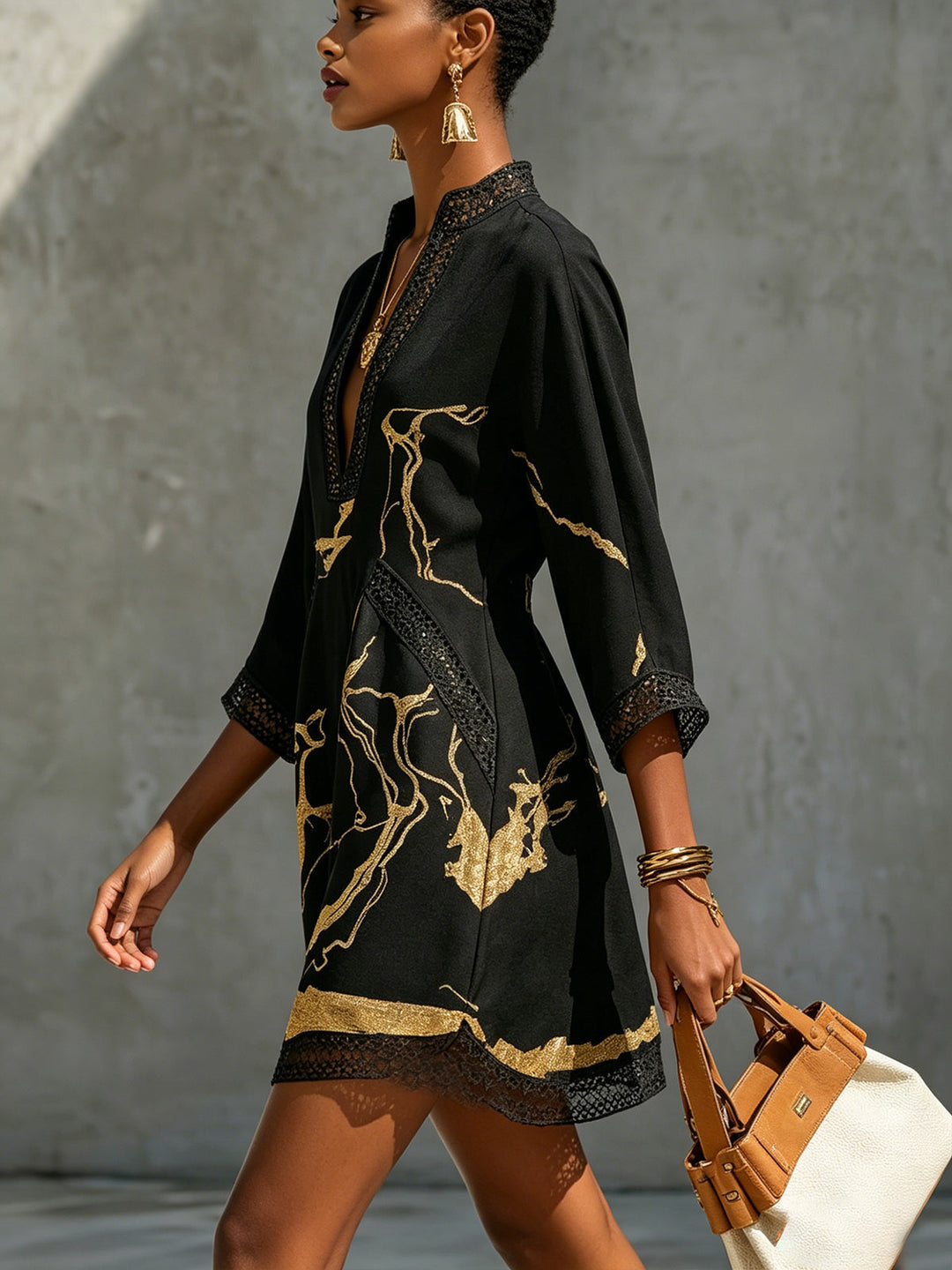 Donatella | Mini dress in black with golden marble print and crochet lace