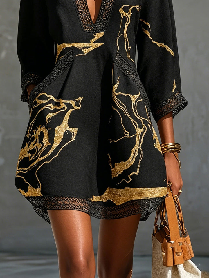 Donatella | Mini dress in black with golden marble print and crochet lace